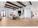 Spacious living area with wood beams and tile floors at 2346 E Sanoque Ct, Gilbert, AZ 85298