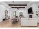Open living room with fireplace and wood beams at 2346 E Sanoque Ct, Gilbert, AZ 85298