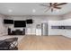 Entertainment area with a kitchenette and large screen TVs at 2346 E Sanoque Ct, Gilbert, AZ 85298