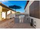 Outdoor kitchen with stainless steel grill and tile accents at 2346 E Sanoque Ct, Gilbert, AZ 85298