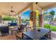Spacious covered patio with seating area and dining table at 2346 E Sanoque Ct, Gilbert, AZ 85298