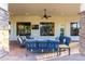 Spacious covered patio with comfortable seating and ceiling fan at 2346 E Sanoque Ct, Gilbert, AZ 85298