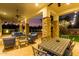 Covered patio with seating area and ceiling fans at 2346 E Sanoque Ct, Gilbert, AZ 85298