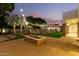 Fire pit and patio furniture on a large brick patio at 2346 E Sanoque Ct, Gilbert, AZ 85298