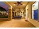 Covered patio with seating area and views of the backyard at 2346 E Sanoque Ct, Gilbert, AZ 85298