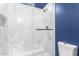 Modern shower with marble tile and glass enclosure at 2346 E Sanoque Ct, Gilbert, AZ 85298