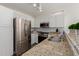 Well-equipped kitchen featuring stainless steel appliances and granite countertops at 3219 E Wickieup Ln, Phoenix, AZ 85050