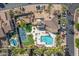 Community pool, tennis courts, and clubhouse at 6202 E Mckellips Rd # 141, Mesa, AZ 85215