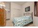 Cozy bedroom with a comfortable bed, dresser, and large closet at 6202 E Mckellips Rd # 141, Mesa, AZ 85215