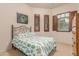Charming bedroom with a cactus-themed bedding and plenty of closet space at 6202 E Mckellips Rd # 141, Mesa, AZ 85215