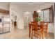 Cozy breakfast nook with wood table and chairs, near the kitchen at 6202 E Mckellips Rd # 141, Mesa, AZ 85215