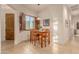 Bright breakfast nook with wood table and chairs, and window seat at 6202 E Mckellips Rd # 141, Mesa, AZ 85215