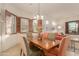 Bright dining area with wood table and chairs, and large windows at 6202 E Mckellips Rd # 141, Mesa, AZ 85215