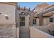 Front entry with pergola, stone accents, and wrought-iron gate at 6202 E Mckellips Rd # 141, Mesa, AZ 85215