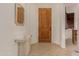 Bright entryway with wood door and tiled floor at 6202 E Mckellips Rd # 141, Mesa, AZ 85215