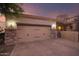 Two-car garage with brick facade and automatic door at 6202 E Mckellips Rd # 141, Mesa, AZ 85215