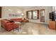 Spacious living room featuring a comfortable sectional sofa and large TV at 6202 E Mckellips Rd # 141, Mesa, AZ 85215