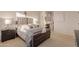 Comfortable main bedroom with upholstered bed and ensuite bathroom access at 6202 E Mckellips Rd # 141, Mesa, AZ 85215