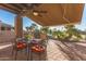 Covered patio with dining set and built-in grill at 6202 E Mckellips Rd # 141, Mesa, AZ 85215