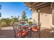 Covered patio with seating area, ceiling fan, and view of the golf course at 6202 E Mckellips Rd # 141, Mesa, AZ 85215