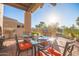 Covered patio with dining area and golf course view at 6202 E Mckellips Rd # 141, Mesa, AZ 85215
