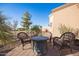 Patio with fire pit and wicker chairs, offering a relaxing outdoor space at 6202 E Mckellips Rd # 141, Mesa, AZ 85215