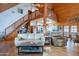 Open living room with loft and wooden staircase at 28216 N 148Th St, Scottsdale, AZ 85262