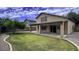 House with covered patio and grassy backyard at 3473 E Bruce Ave, Gilbert, AZ 85234