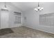 Spacious living room featuring tile floors and a view of the front door at 3473 E Bruce Ave, Gilbert, AZ 85234
