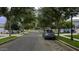 Residential street lined with mature trees and parked cars at 3473 E Bruce Ave, Gilbert, AZ 85234