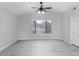 Bedroom featuring wood-look flooring and a ceiling fan at 3473 E Bruce Ave, Gilbert, AZ 85234