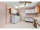 Bright laundry room with washer, dryer, and cabinets at 13247 W Bellwood Dr, Sun City West, AZ 85375