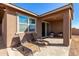 Relaxing backyard patio with seating area at 18055 W Elm St, Goodyear, AZ 85395