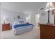 Spacious bedroom with a king-size bed and en-suite bathroom access at 8140 N 107Th Ave # 129, Peoria, AZ 85345