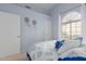 Serene bedroom with a queen-size bed and arched window at 8140 N 107Th Ave # 129, Peoria, AZ 85345