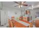 Charming dining area with wooden table and chairs, overlooking the kitchen at 8140 N 107Th Ave # 129, Peoria, AZ 85345