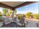 Covered patio with comfortable seating and a view of the yard at 8140 N 107Th Ave # 129, Peoria, AZ 85345