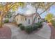 Landscaped exterior of the property with a walkway at 8140 N 107Th Ave # 129, Peoria, AZ 85345