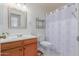 Clean bathroom with a shower/tub combo and wood vanity at 8140 N 107Th Ave # 129, Peoria, AZ 85345