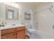 Clean bathroom with a shower/tub combo and wood vanity at 8140 N 107Th Ave # 129, Peoria, AZ 85345