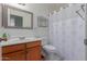 Clean bathroom with shower/tub combo and wood vanity at 8140 N 107Th Ave # 129, Peoria, AZ 85345