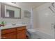 Clean bathroom with shower/tub combo and wood vanity at 8140 N 107Th Ave # 129, Peoria, AZ 85345