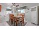 Bright dining area with wooden table and chairs near a kitchen at 8140 N 107Th Ave # 129, Peoria, AZ 85345