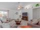 Living room with neutral tones, a fireplace, and access to other rooms at 8140 N 107Th Ave # 129, Peoria, AZ 85345