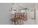 Cozy dining area with a wooden table and chairs, adjacent to the kitchen at 8140 N 107Th Ave # 129, Peoria, AZ 85345