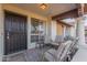 Inviting front porch with seating area, perfect for relaxing at 8140 N 107Th Ave # 129, Peoria, AZ 85345