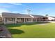Spacious backyard with artificial turf and covered patio at 19039 N 90Th Ln, Peoria, AZ 85382