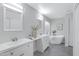 Elegant bathroom with double sinks, a freestanding tub, and gray tile floors at 19039 N 90Th Ln, Peoria, AZ 85382