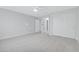 Bright bedroom with grey carpet, double doors to closet, and access to bathroom at 19039 N 90Th Ln, Peoria, AZ 85382