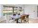 Bright dining area with a large wooden table and seating for four at 19039 N 90Th Ln, Peoria, AZ 85382